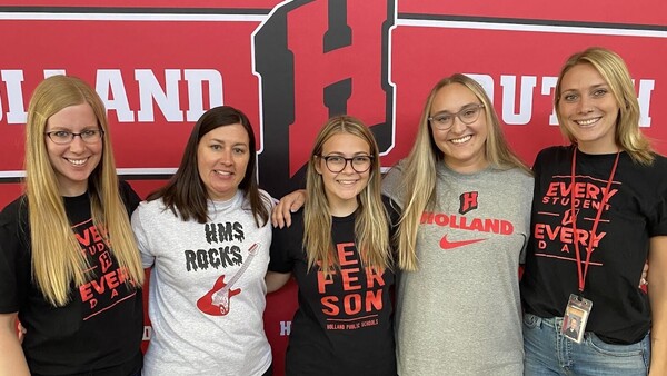 5 Holland OCSN Coordinators standing in front of Holland Dutch backdrop.