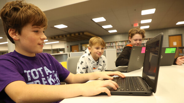 student with Chromebook
