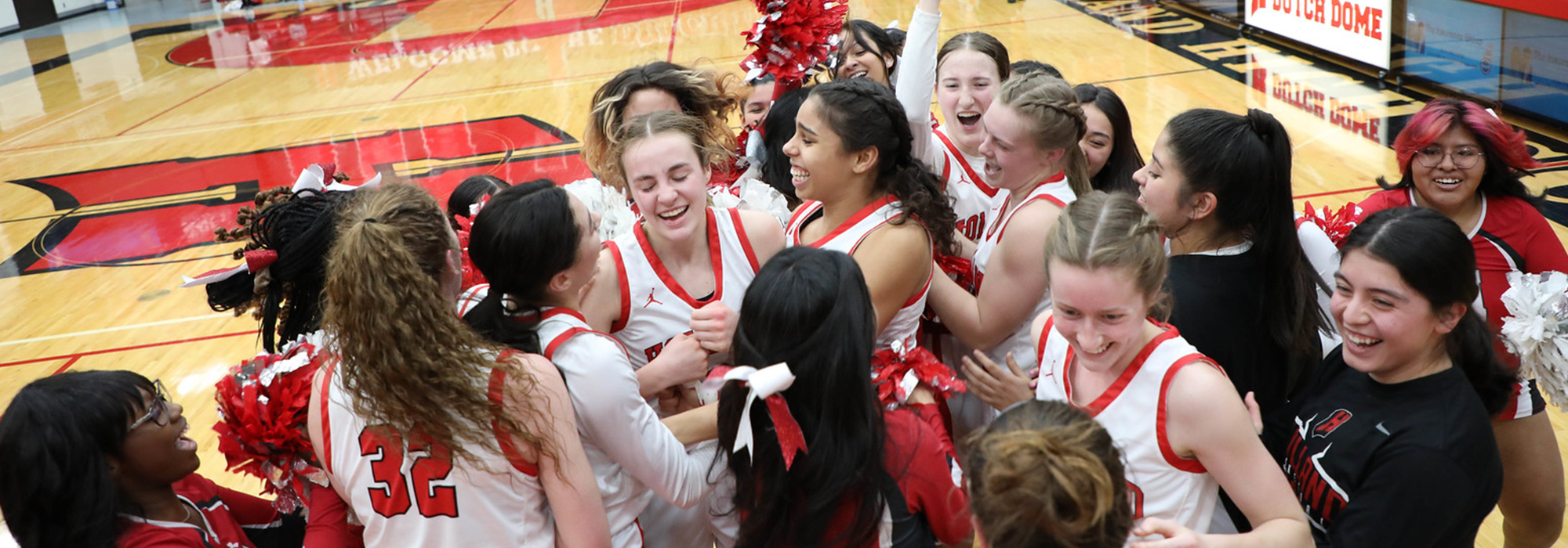 girls celebrate basketball win