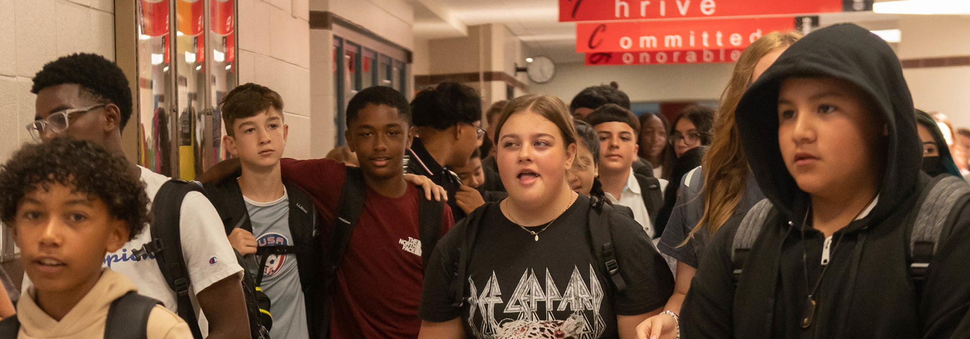 students walk in hallway