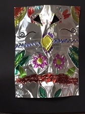 a student's artwork of a tin mask