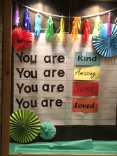 a billboard posted in the West hallway saying positive "you are so..."